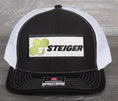 Load image into Gallery viewer, Steiger Tractor patch on a Richardson 112 trucker hat - black
