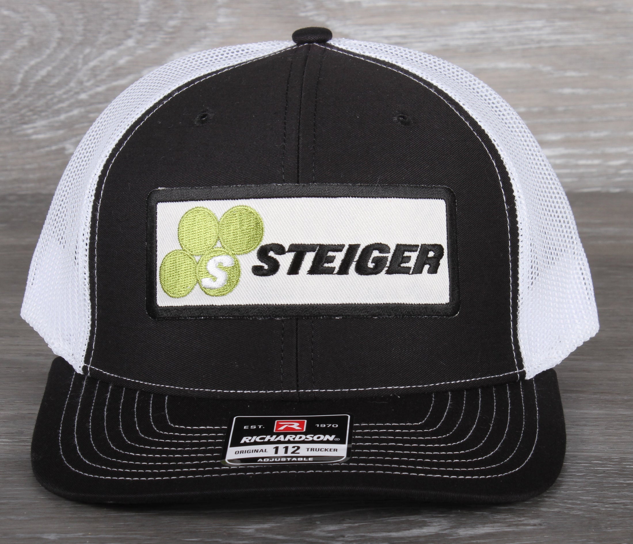 Steiger Tractor patch on a Richardson 112 trucker hat - black