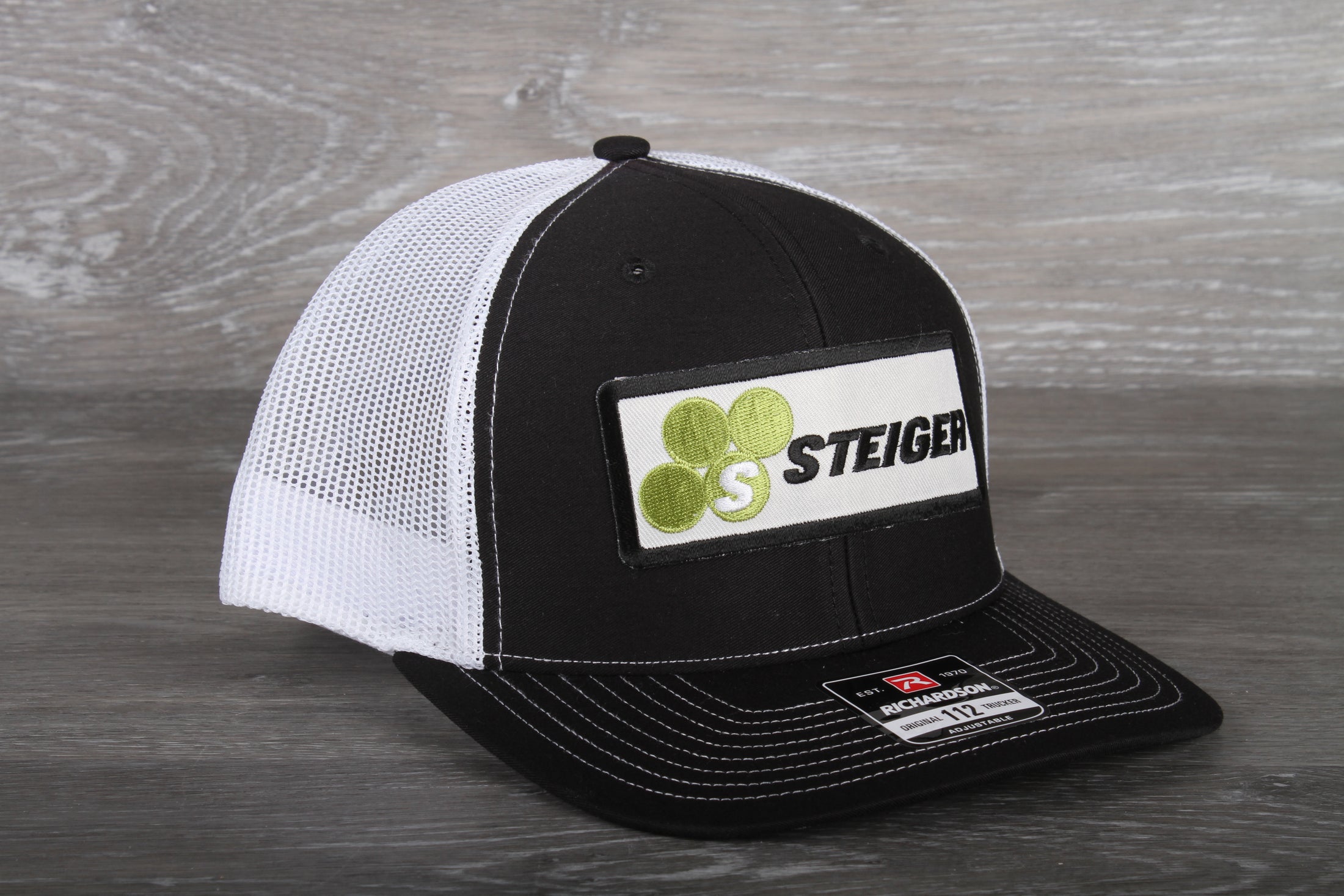 Steiger Tractor patch on a Richardson 112 trucker hat - black