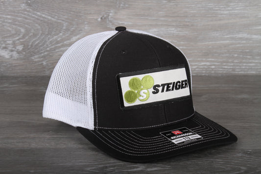 Steiger Tractor patch on a Richardson 112 trucker hat - black