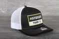 Load image into Gallery viewer, Steiger Tiger Tractor patch on a Richardson 112 trucker hat
