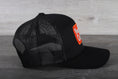 Load image into Gallery viewer, Vintage Hummin' Cummins patch on a Pacific 104C trucker hat
