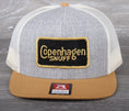 Load image into Gallery viewer, Vintage Copenhagen Snuff patch on a Richardson 511 trucker hat
