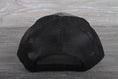 Load image into Gallery viewer, Vintage Midas Muffler patch on a Richardson 112
