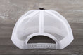Load image into Gallery viewer, Vintage Champion patch on a Richardson 112 trucker hat
