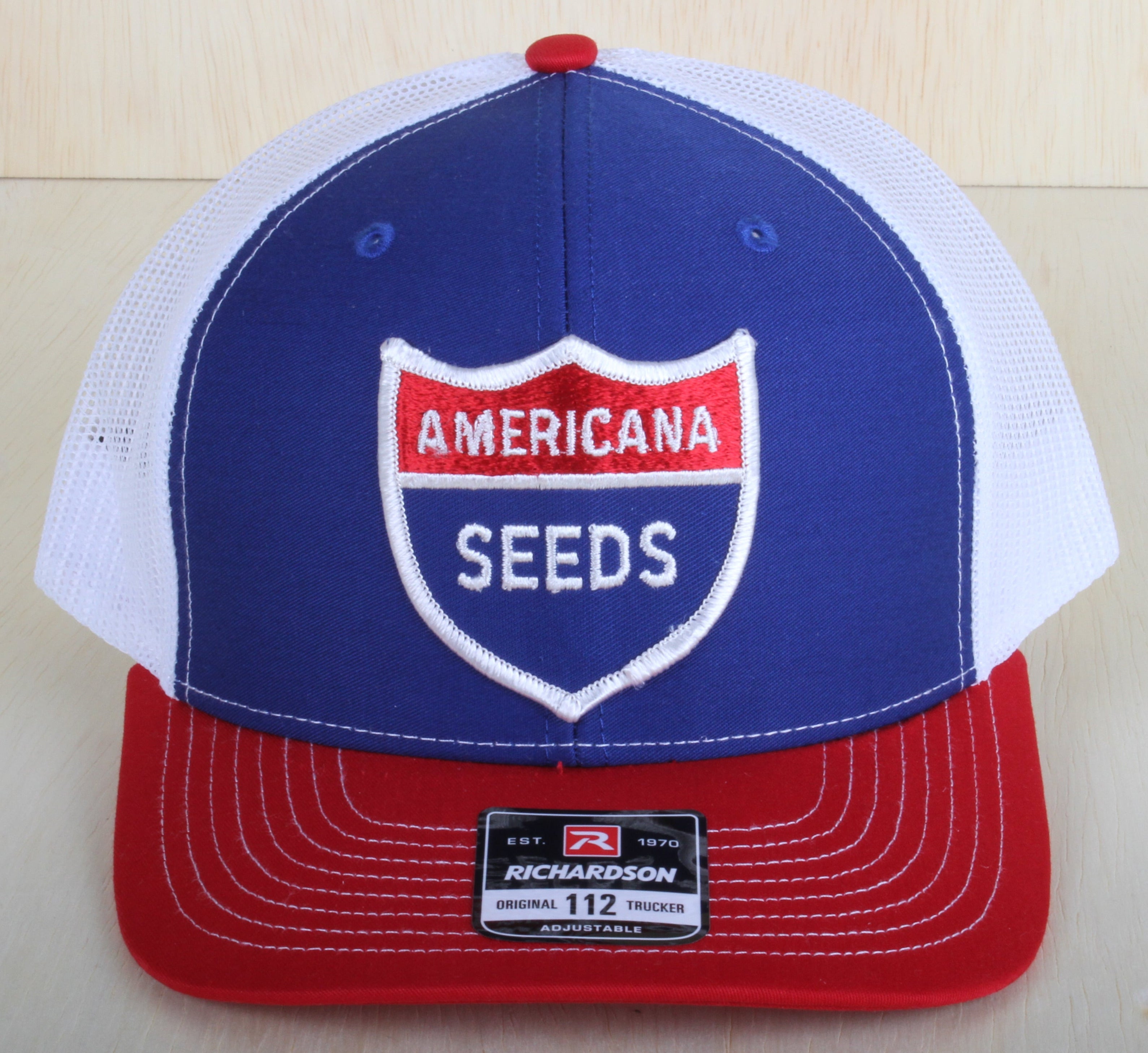 Vintage Americana Seeds patch on a Richardson 112 trucker hat