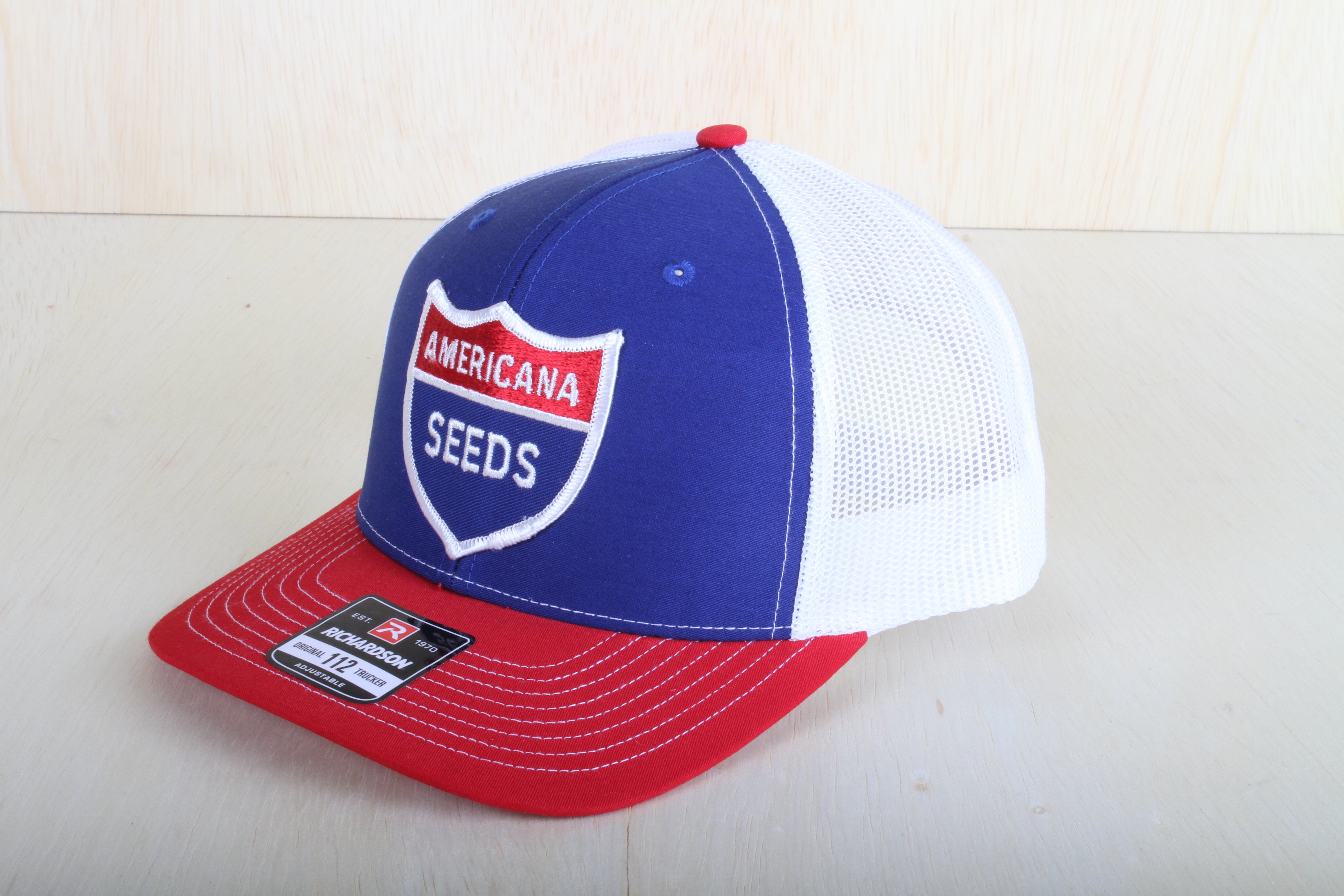 Vintage Americana Seeds patch on a Richardson 112 trucker hat